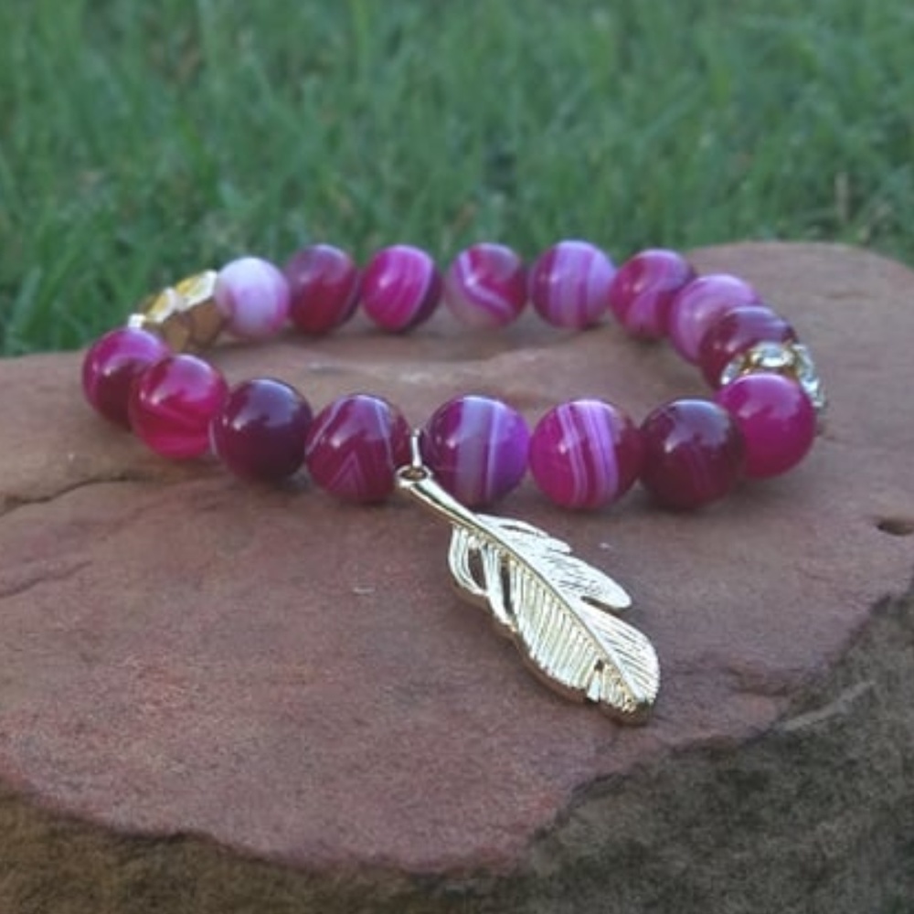 Beaded bracelet w/ feather charm